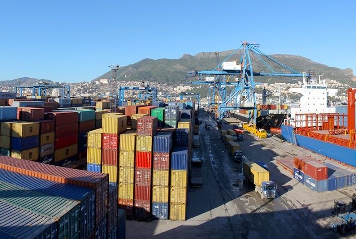 Cargo ship loading containers at an Algerian port